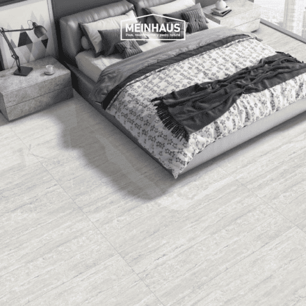 Diseño moderno de dormitorio con pisos de piedra natural y revestimientos de alta calidad, ideal para decorar espacios elegantes y resistentes en viviendas y oficinas en Ecuador.